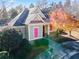 Community clubhouse with gray siding, pink shutters, and copper roof at 2591 Royston Dr, Duluth, GA 30097