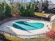 Community pool with safety cover, surrounded by a fence at 2591 Royston Dr, Duluth, GA 30097