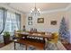 Formal dining room with a wood table, bench, and chandelier at 2591 Royston Dr, Duluth, GA 30097