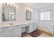 Elegant bathroom with double vanity, soaking tub, and separate shower at 2604 Alvecot Cir, Atlanta, GA 30339