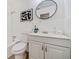 Clean bathroom with white tile, vanity, and updated fixtures at 3515 Panola Rd, Lithonia, GA 30038