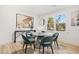 Bright dining room with glass table and gray chairs near window at 3515 Panola Rd, Lithonia, GA 30038