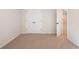 Empty bedroom with double doors and neutral-colored carpet at 3686 Bills Cir, Atlanta, GA 30331