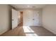 Empty bedroom featuring carpet, double doors, and an open doorway at 3686 Bills Cir, Atlanta, GA 30331