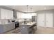 Modern kitchen with gray and white cabinets, island and stainless steel appliances at 48 Rogers Se St, Atlanta, GA 30317