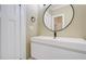 Modern bathroom with circular mirror, floating vanity, and black fixtures at 536 Moreland Ne Ave, Atlanta, GA 30307