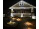 The home's front yard at night, illuminated by landscape lighting, showcasing the fountain at 536 Moreland Ne Ave, Atlanta, GA 30307