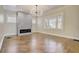 Spacious living room with fireplace, hardwood floors, and coffered ceiling at 536 Moreland Ne Ave, Atlanta, GA 30307