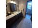 Bathroom with a vanity, sink, and access to another bathroom at 1824 Smith Store Rd, Covington, GA 30016