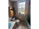 Simple bathroom with a shower/tub combo and a window at 1824 Smith Store Rd, Covington, GA 30016
