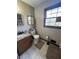 Small bathroom with granite vanity and tiled floor at 1824 Smith Store Rd, Covington, GA 30016