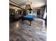 Game room with pool table and wood-look floors at 1824 Smith Store Rd, Covington, GA 30016