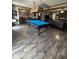 Game room featuring a pool table and wood-look floors at 1824 Smith Store Rd, Covington, GA 30016