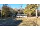 Three-car garage with covered carport and storage shed at 1824 Smith Store Rd, Covington, GA 30016
