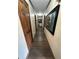 Long hallway with wood-look flooring and artwork at 1824 Smith Store Rd, Covington, GA 30016