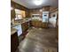 Kitchen with wood cabinets, granite countertops, and dishwasher at 1824 Smith Store Rd, Covington, GA 30016