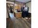 Kitchen with wood cabinets and black refrigerator at 1824 Smith Store Rd, Covington, GA 30016