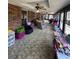 Bright sunroom with ample seating and large windows at 1824 Smith Store Rd, Covington, GA 30016