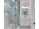 Modern bathroom with glass shower, vanity, and quartz countertop at 2626 Sardis Way, Buford, GA 30519