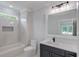 Bathroom with white subway tile, vanity and bathtub at 2626 Sardis Way, Buford, GA 30519