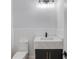 Modern powder room with white quartz countertop and dark vanity at 2626 Sardis Way, Buford, GA 30519