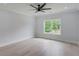 Bright bedroom featuring hardwood floors and a large window at 2626 Sardis Way, Buford, GA 30519