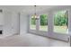 Light-filled dining room with hardwood floors and a chandelier at 2626 Sardis Way, Buford, GA 30519