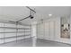 Garage with epoxy flooring, overhead storage, and utility area at 2626 Sardis Way, Buford, GA 30519
