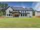Two-story house with a large backyard and covered patio at 2626 Sardis Way, Buford, GA 30519