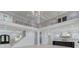 Open concept kitchen with a large island, white cabinets, and high-end appliances at 2626 Sardis Way, Buford, GA 30519