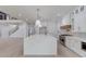 Gourmet kitchen with stainless steel appliances, an expansive island, and marble countertops at 2626 Sardis Way, Buford, GA 30519