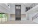 Two-story living room with a dramatic fireplace and chandelier, offering an open and airy feel at 2626 Sardis Way, Buford, GA 30519