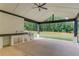 Outdoor kitchen with built-in grill and sink under covered patio at 2626 Sardis Way, Buford, GA 30519