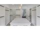 Bright Primary closet with center island and custom shelving at 2626 Sardis Way, Buford, GA 30519
