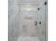Large walk-in shower with marble tile and a built-in shelf at 2626 Sardis Way, Buford, GA 30519