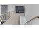 Bright upstairs hall with modern railings and light floors at 2626 Sardis Way, Buford, GA 30519