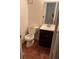 Half bathroom with toilet, vanity, and mirror at 2705 Greystone Pl, Austell, GA 30106