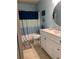 Bathroom with white vanity, blue walls, and tiled floor at 2705 Greystone Pl, Austell, GA 30106