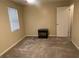 Empty bedroom with carpet flooring and a small nightstand at 2705 Greystone Pl, Austell, GA 30106