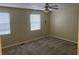 Spacious bedroom with neutral walls, carpet, ceiling fan, and blinds at 2705 Greystone Pl, Austell, GA 30106