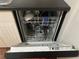 Open dishwasher with dishes inside at 2705 Greystone Pl, Austell, GA 30106