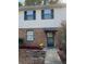 Inviting two-story home with brick and siding exterior, landscaping, and walkway at 2705 Greystone Pl, Austell, GA 30106