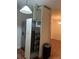 Kitchen pantry with pull-out shelves beside stainless steel refrigerator at 2705 Greystone Pl, Austell, GA 30106