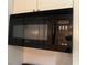 Over-the-range black Maytag microwave installed above the oven at 2705 Greystone Pl, Austell, GA 30106