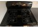 Close-up of a black Maytag oven with four burners and digital display at 2705 Greystone Pl, Austell, GA 30106