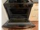 Open oven with multiple racks inside at 2705 Greystone Pl, Austell, GA 30106