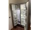 Open refrigerator showcasing shelves and storage compartments at 2705 Greystone Pl, Austell, GA 30106