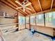 Unfinished screened porch with concrete floor and ceiling fan at 2705 Greystone Pl, Austell, GA 30106
