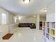 Finished basement with living area and built-in shelving at 370 Charlyne Way, Dacula, GA 30019