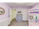 ' bedroom with bunk beds, dresser, and purple walls at 370 Charlyne Way, Dacula, GA 30019